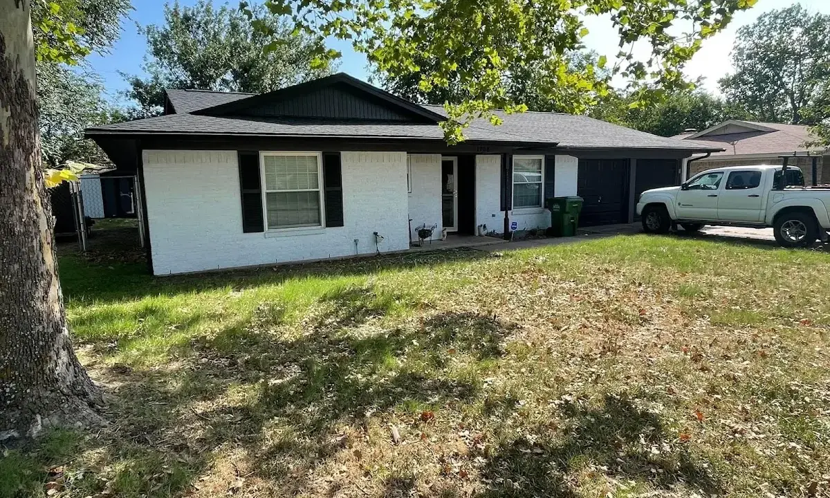 Professional roofing crew working on a residential roof in Mount Zion